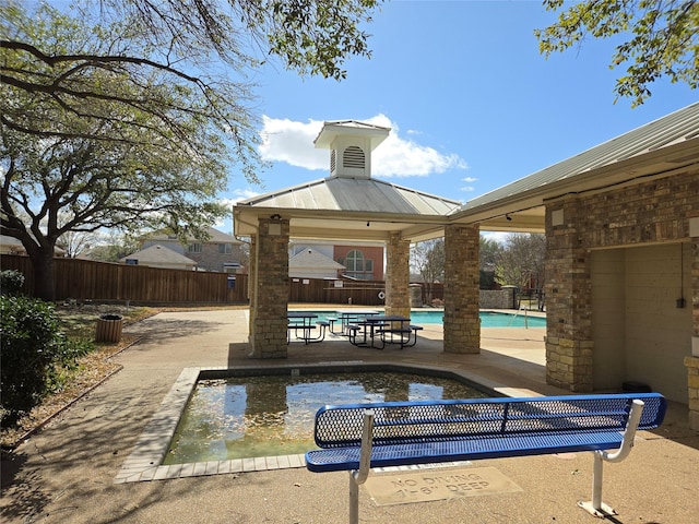 view of home's community featuring a gazebo, a pool, fence, and a patio