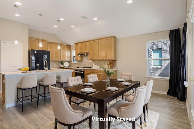 3954 Brangus Dr, Mckinney, TX 75071 - dining space with light wood-type flooring, a healthy amount of sunlight, and vaulted ceiling