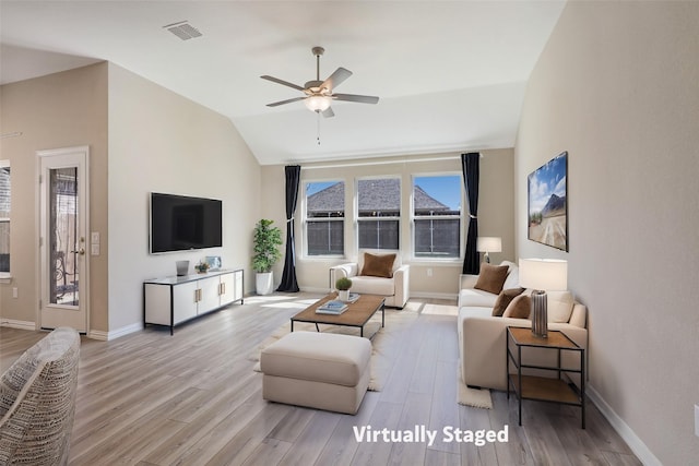 3954 Brangus Dr, Mckinney, TX 75071 - living room with vaulted ceiling, wood finished floors, and baseboards