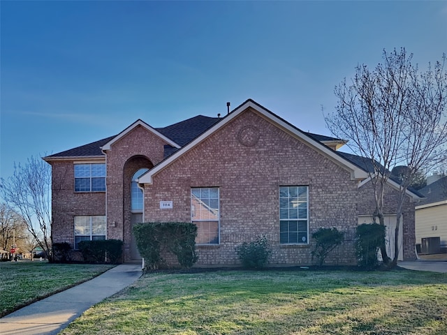 1114 Huntington Trl, Mansfield, TX 76063 - traditional home with brick siding, cooling unit, and a front yard