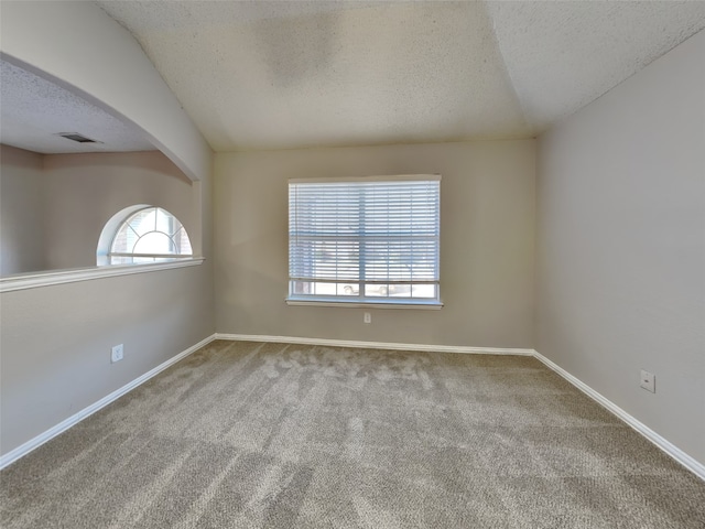 1114 Huntington Trl, Mansfield, TX 76063 - empty room featuring baseboards, visible vents, arched walkways, a textured ceiling, and carpet flooring