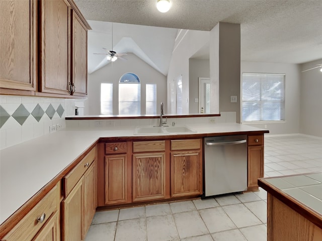 1114 Huntington Trl, Mansfield, TX 76063 - kitchen with stainless steel dishwasher, light countertops, a ceiling fan, and a sink