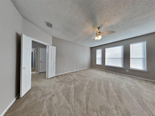 1114 Huntington Trl, Mansfield, TX 76063 - carpeted empty room featuring a textured ceiling, a ceiling fan, visible vents, and baseboards