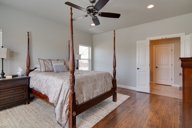 bedroom with recessed lighting, baseboards, a ceiling fan, wood finished floors, and visible vents
