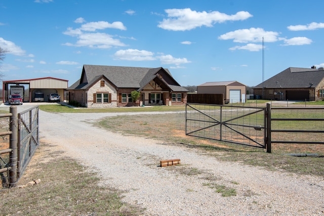 view of street with driveway, a gated entry, and a gate