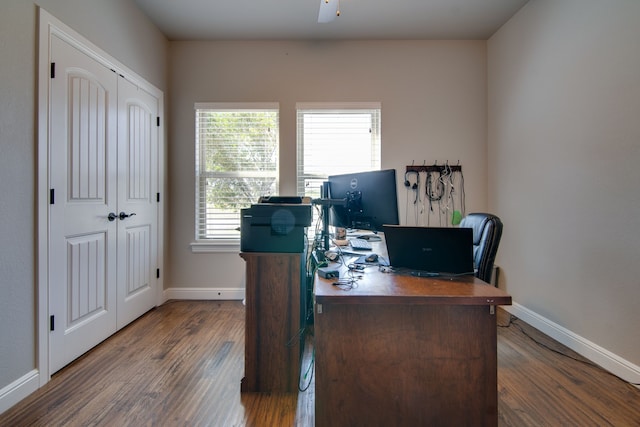 home office featuring baseboards, ceiling fan, and wood finished floors
