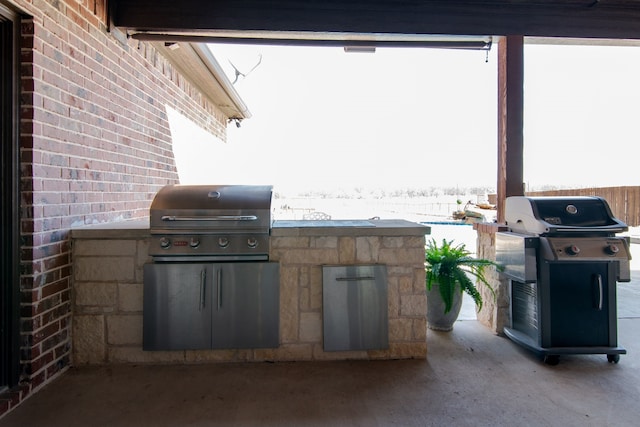 view of patio with grilling area and exterior kitchen