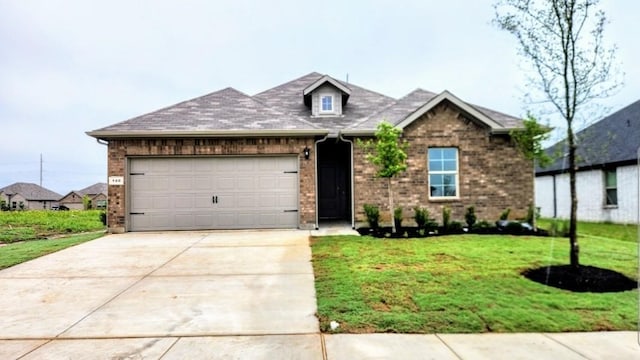 140 Trinity St, Grandview, TX 76050 - view of front of home featuring an attached garage, driveway, brick siding, and a front yard