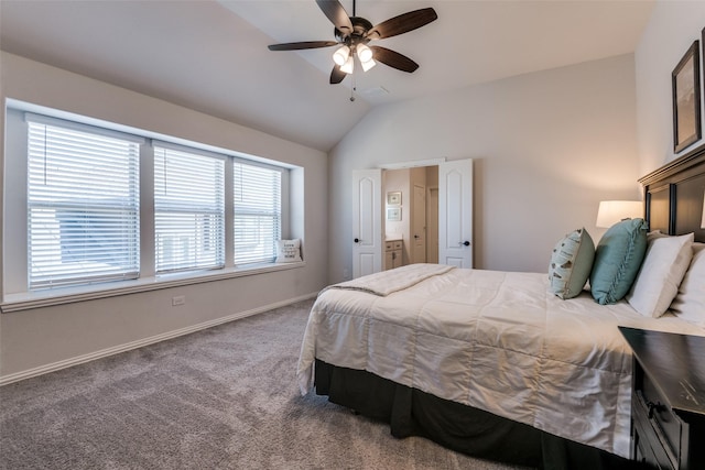 carpeted bedroom with vaulted ceiling, baseboards, connected bathroom, and a ceiling fan