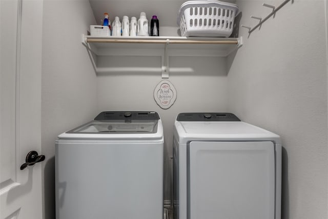 laundry area featuring washing machine and dryer and laundry area