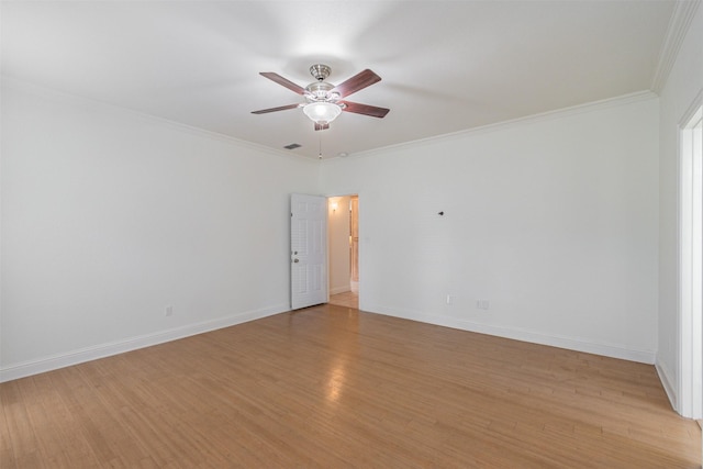 10471 Holly Creek Rd, Poetry, TX 75160 - empty room featuring visible vents, baseboards, ceiling fan, crown molding, and light wood-type flooring