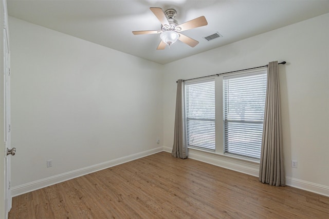 10471 Holly Creek Rd, Poetry, TX 75160 - empty room featuring baseboards, light wood-style floors, visible vents, and ceiling fan