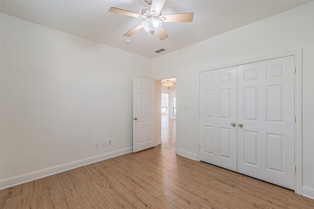 10471 Holly Creek Rd, Poetry, TX 75160 - unfurnished bedroom with visible vents, baseboards, light wood-style floors, and a closet
