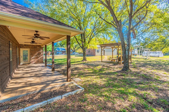 10471 Holly Creek Rd, Poetry, TX 75160 - view of yard with a playground, a patio area, a pergola, and ceiling fan