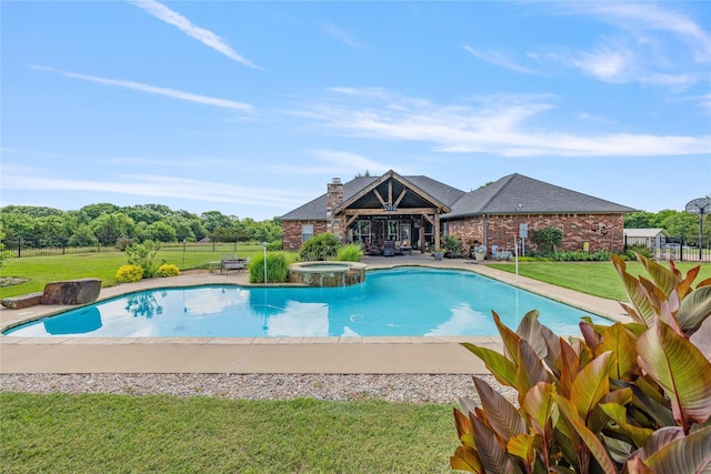 4933 County Road 340, Mckinney, TX 75071 - view of swimming pool featuring a pool with connected hot tub, fence, a patio area, and a lawn