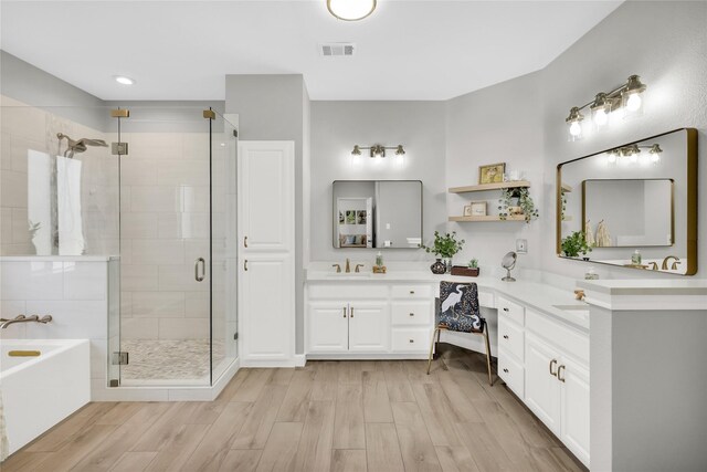 4933 County Road 340, Mckinney, TX 75071 - full bath with wood finished floors, vanity, a stall shower, and a bath