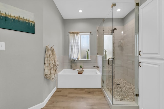 4933 County Road 340, Mckinney, TX 75071 - full bath featuring wood tiled floor, a shower stall, a bath, baseboards, and recessed lighting