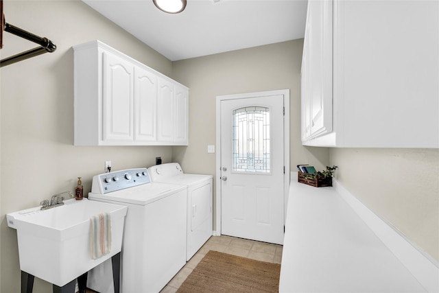 4933 County Road 340, Mckinney, TX 75071 - laundry room with light tile patterned flooring, cabinet space, a sink, and washer and dryer