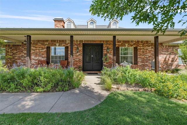 4933 County Road 340, Mckinney, TX 75071 - property entrance with covered porch and brick siding