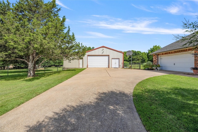 4933 County Road 340, Mckinney, TX 75071 - view of front of property featuring a detached garage, fence, a front lawn, and an outbuilding