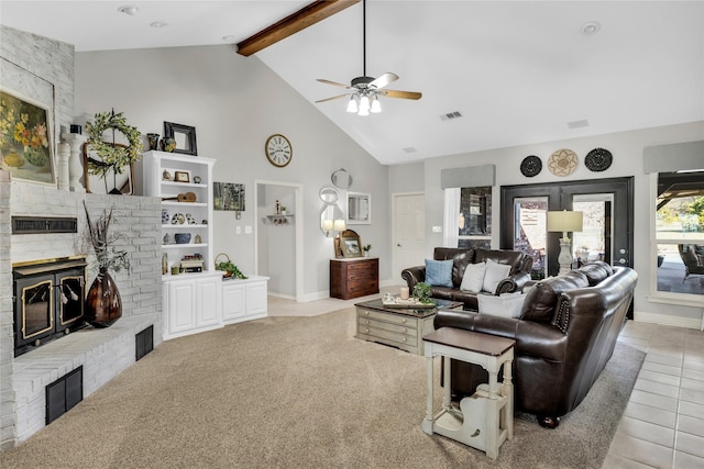 4933 County Road 340, Mckinney, TX 75071 - living area with high vaulted ceiling, beam ceiling, a ceiling fan, a fireplace, and visible vents