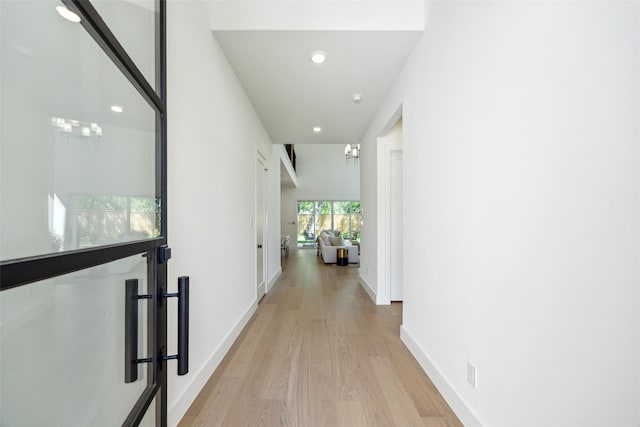 4415 Merrell Rd, Dallas, TX 75229 - corridor featuring light wood-style floors, recessed lighting, and baseboards
