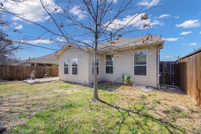 405 Waterton Dr, Anna, TX 75409 - back of property with a patio, a fenced backyard, and a lawn