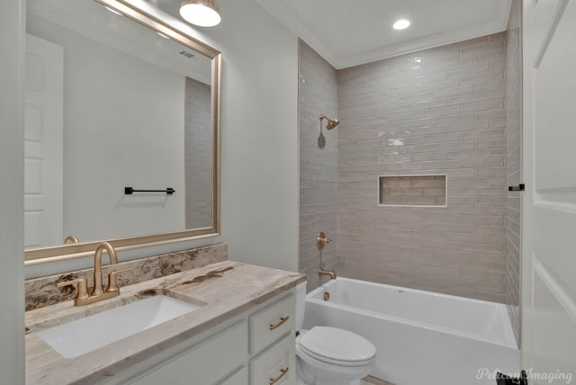 full bathroom featuring visible vents, toilet, vanity, and bathtub / shower combination
