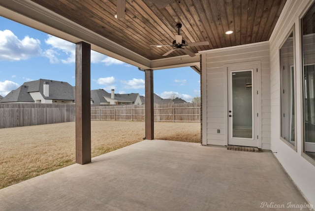 view of patio featuring a residential view, a fenced backyard, and a ceiling fan