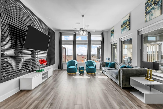 7436 Whisterwheel Way, Fort Worth, TX 76123 - living room with visible vents, wood finished floors, baseboards, and ceiling fan