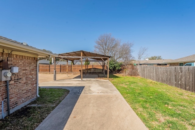 view of yard with a gazebo, a patio area, and a fenced backyard