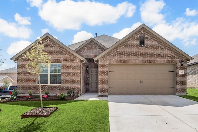ranch-style house featuring driveway, brick siding, an attached garage, and a front yard