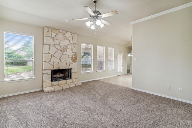 3104 Rim Rock Ct, Granbury, TX 76049 - unfurnished living room featuring a stone fireplace, a ceiling fan, baseboards, and light carpet