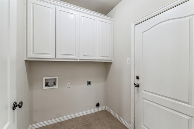 3104 Rim Rock Ct, Granbury, TX 76049 - clothes washing area featuring baseboards, hookup for a washing machine, tile patterned floors, cabinet space, and electric dryer hookup