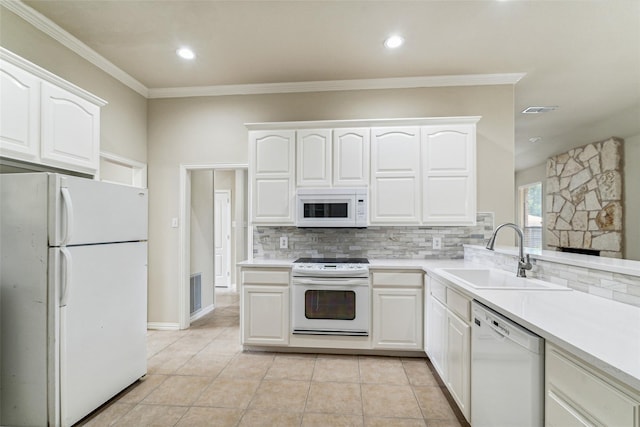 3104 Rim Rock Ct, Granbury, TX 76049 - kitchen featuring a sink, white appliances, tasteful backsplash, and white cabinets