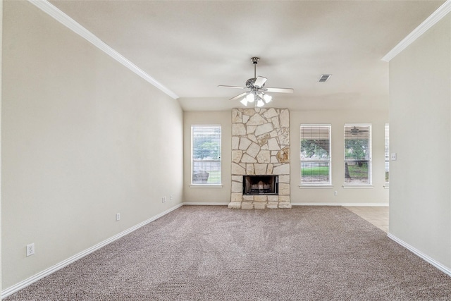 3104 Rim Rock Ct, Granbury, TX 76049 - unfurnished living room featuring a stone fireplace, crown molding, visible vents, and ceiling fan
