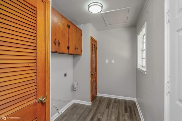 laundry area with electric dryer hookup, dark wood-type flooring, cabinet space, baseboards, and attic access