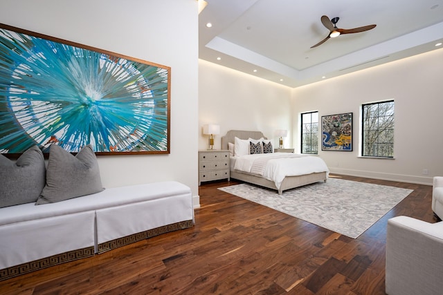 1230 Oak View Ct, Oak Point, TX 75068 - bedroom with wood finished floors, a raised ceiling, baseboards, recessed lighting, and a ceiling fan