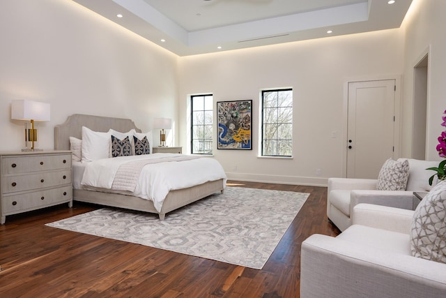 1230 Oak View Ct, Oak Point, TX 75068 - bedroom with dark wood-type flooring, baseboards, a high ceiling, a raised ceiling, and recessed lighting
