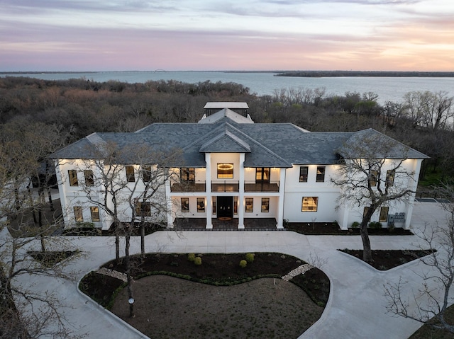 1230 Oak View Ct, Oak Point, TX 75068 - property at dusk featuring a water view