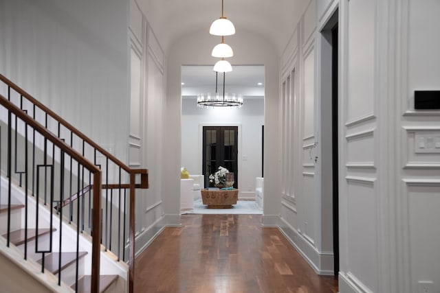 1230 Oak View Ct, Oak Point, TX 75068 - entrance foyer with wood finished floors, stairway, a decorative wall, baseboards, and a chandelier