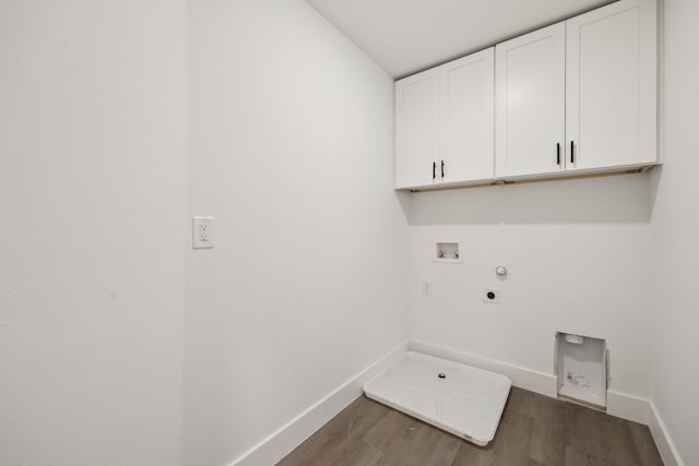 clothes washing area with cabinet space, hookup for an electric dryer, hookup for a gas dryer, hookup for a washing machine, and wood finished floors