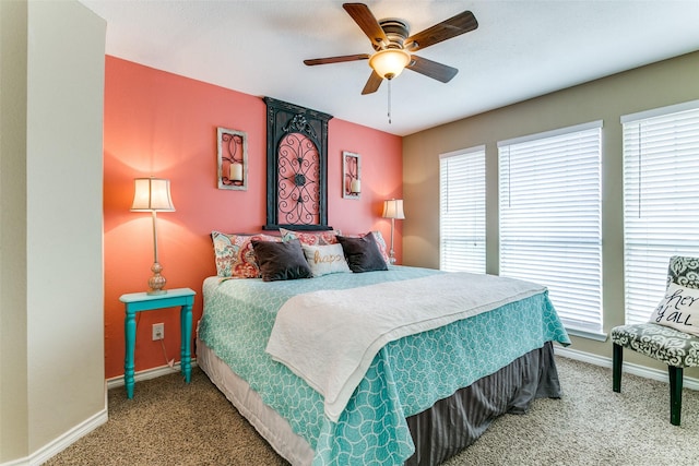 227 Moss Hill Rd, Irving, TX 75063 - carpeted bedroom with multiple windows, baseboards, and ceiling fan