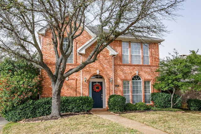 227 Moss Hill Rd, Irving, TX 75063 - traditional-style home with brick siding and a front lawn
