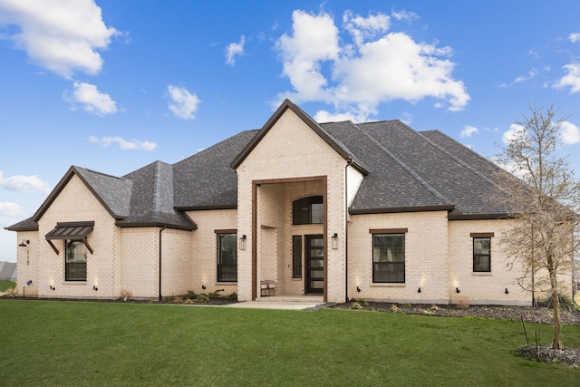 113 Adams Ct, Weston, TX 75009 - view of front of home featuring a front yard, roof with shingles, and brick siding