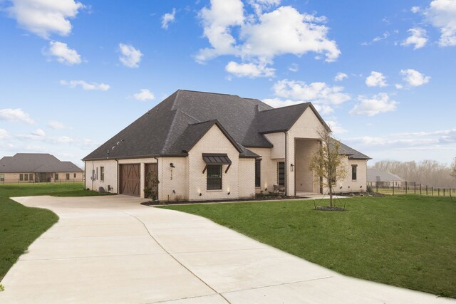 113 Adams Ct, Weston, TX 75009 - french country inspired facade featuring roof with shingles, fence, an attached garage, concrete driveway, and a front yard