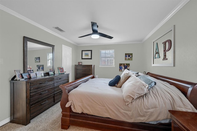bedroom featuring visible vents, light colored carpet, a ceiling fan, and ornamental molding