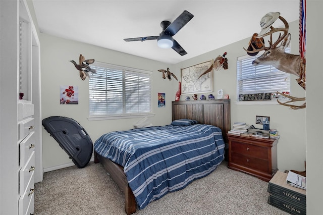 carpeted bedroom featuring a ceiling fan