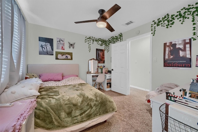 bedroom with visible vents, baseboards, ceiling fan, and carpet floors