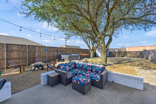 view of patio / terrace featuring an outdoor living space with a fire pit and a fenced backyard